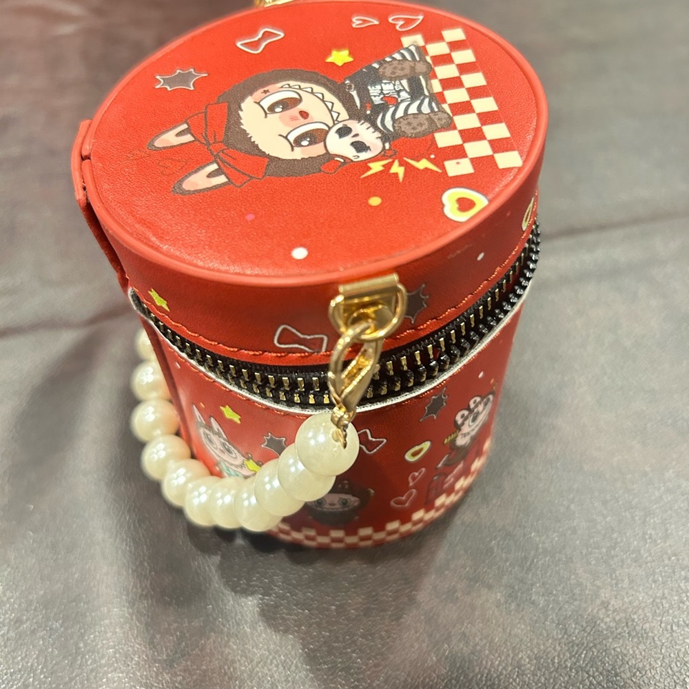 Red Labubu Print Round carry Bag with 20 lipglosses and Pearl Handle.